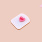 A yellow acrylic pin badge with a pink heart-shaped pin back clasp. The design of the pin badge is of a cute mouse napping in bed with a patchwork quilt with the quote can't mistakey if not awakey.