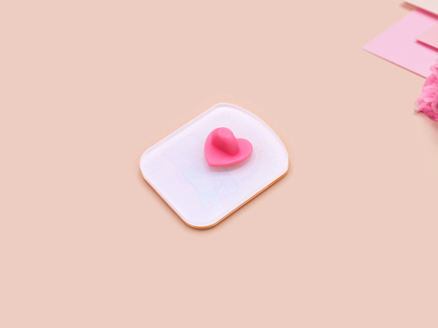 A yellow acrylic pin badge with a pink heart-shaped pin back clasp. The design of the pin badge is of a cute mouse napping in bed with a patchwork quilt with the quote can't mistakey if not awakey.