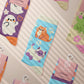 Multiple Cute knitted cotton crew socks with autumn-themed ghost designs, cute cats and kittens, and funny pastel frogs.