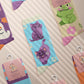 Multiple Cute knitted cotton crew socks with autumn-themed ghost designs, cute cats and kittens, and funny pastel frogs.
