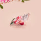 This cute transparent acrylic pin badge has a pink rubber heart shrimp pin-back clasp. The design is of a chibi cartoon mushroom with the text "Come back with a warrant."
