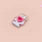 This cute transparent acrylic pin badge has a pink rubber heart shrimp pin-back clasp. The design is of a chibi cartoon mushroom with the text "Come back with a warrant."