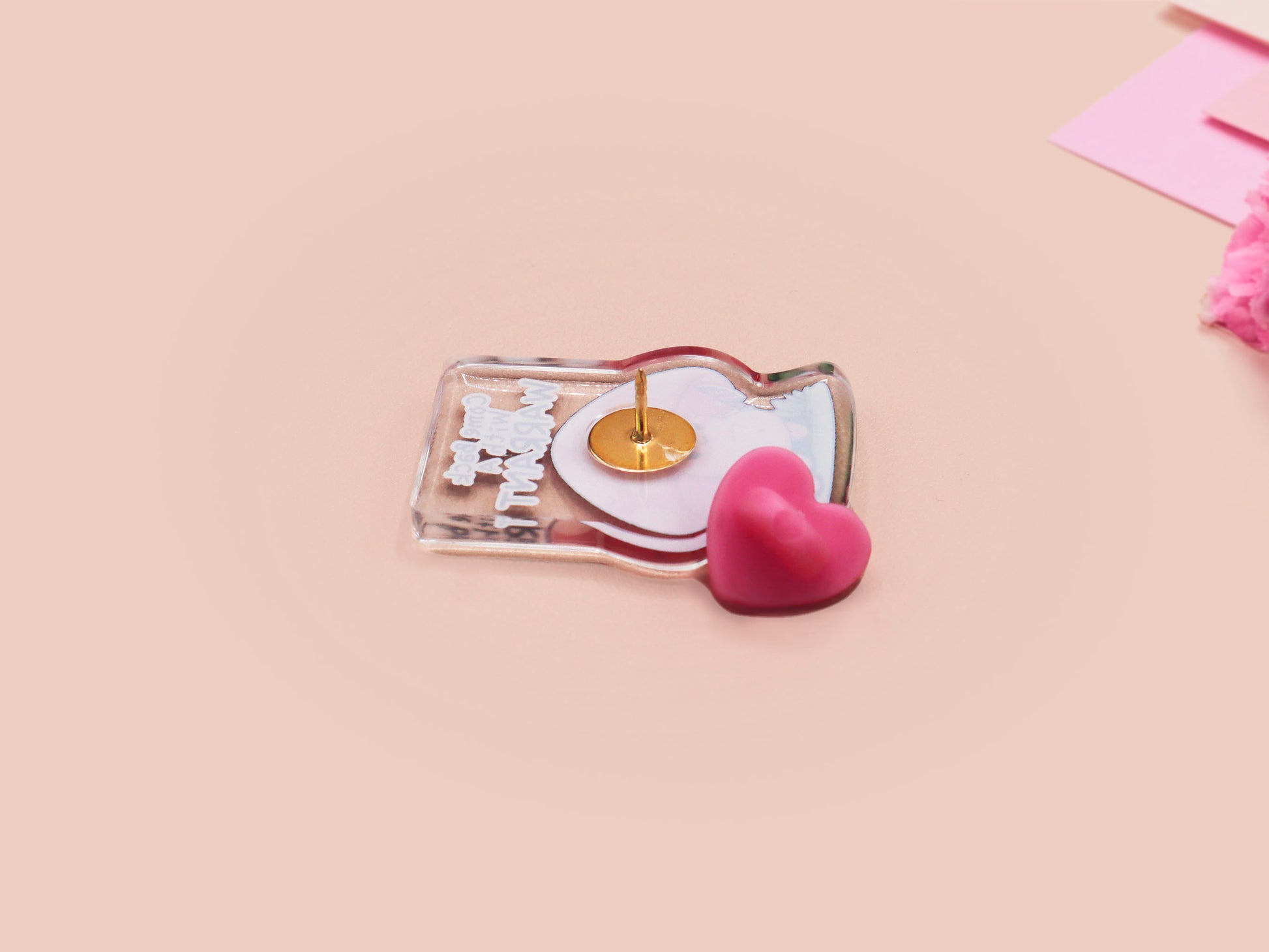 This cute transparent acrylic pin badge has a pink rubber heart shrimp pin-back clasp. The design is of a chibi cartoon mushroom with the text "Come back with a warrant."