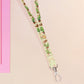 Cute full legth yellow and green lanyard with a double sided cowboy western and cactus themed pattern and silver swivel hook clasp.