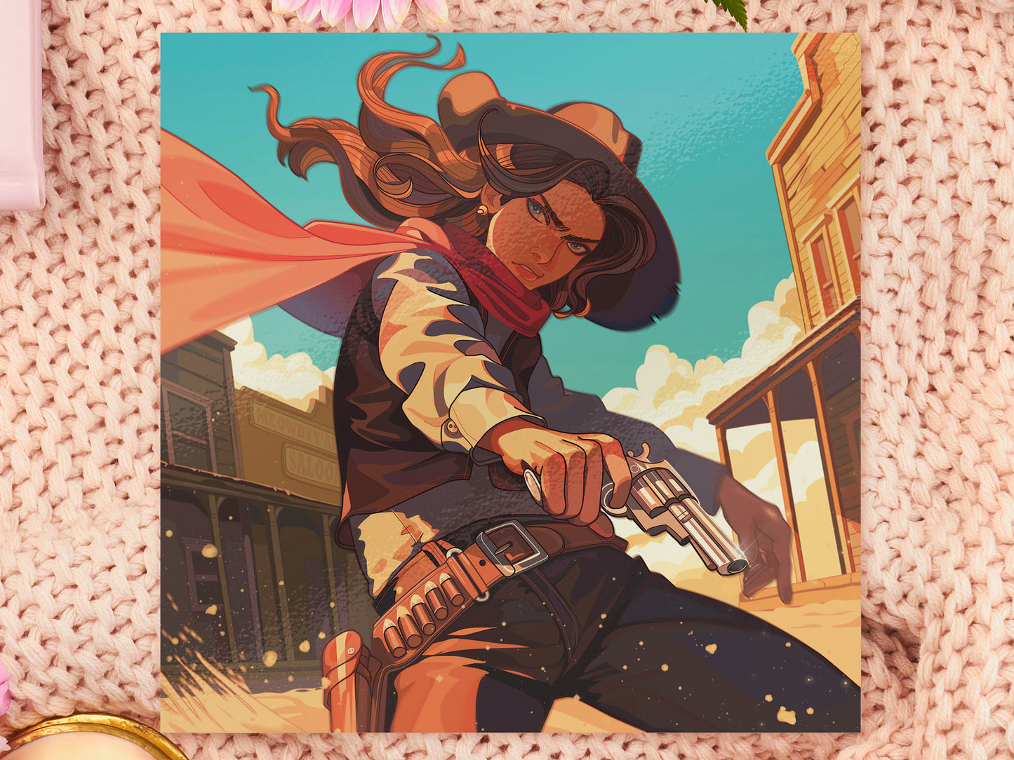A square art print depicting a cowgirl gunslinger in a dramatic pose in the wild west outside a saloon.