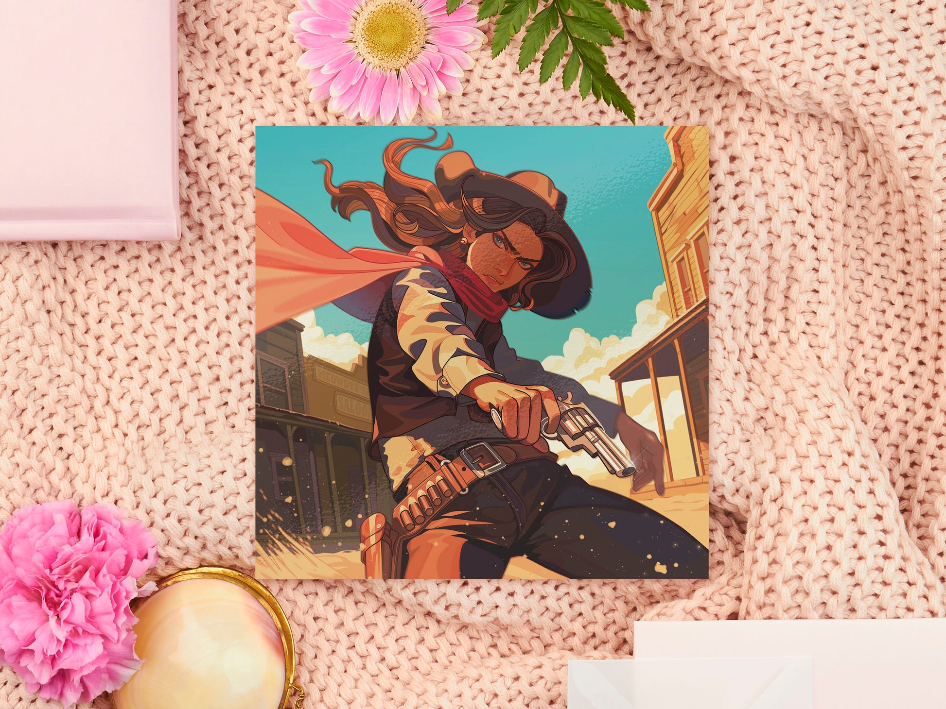 A square art print depicting a cowgirl gunslinger in a dramatic pose in the wild west outside a saloon.