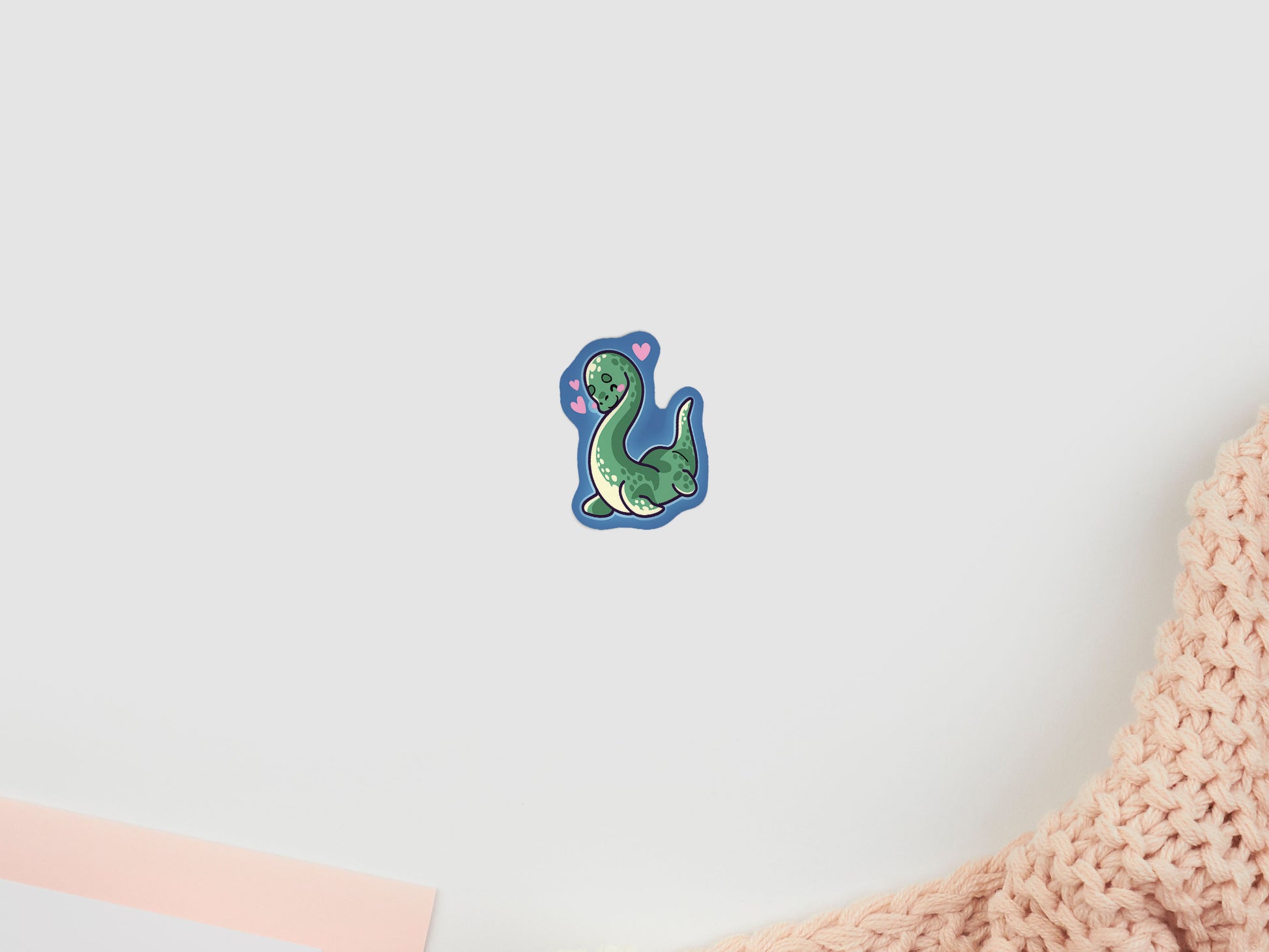 A cute gloss vinyl waterproof sticker of Nessie the loch ness monster