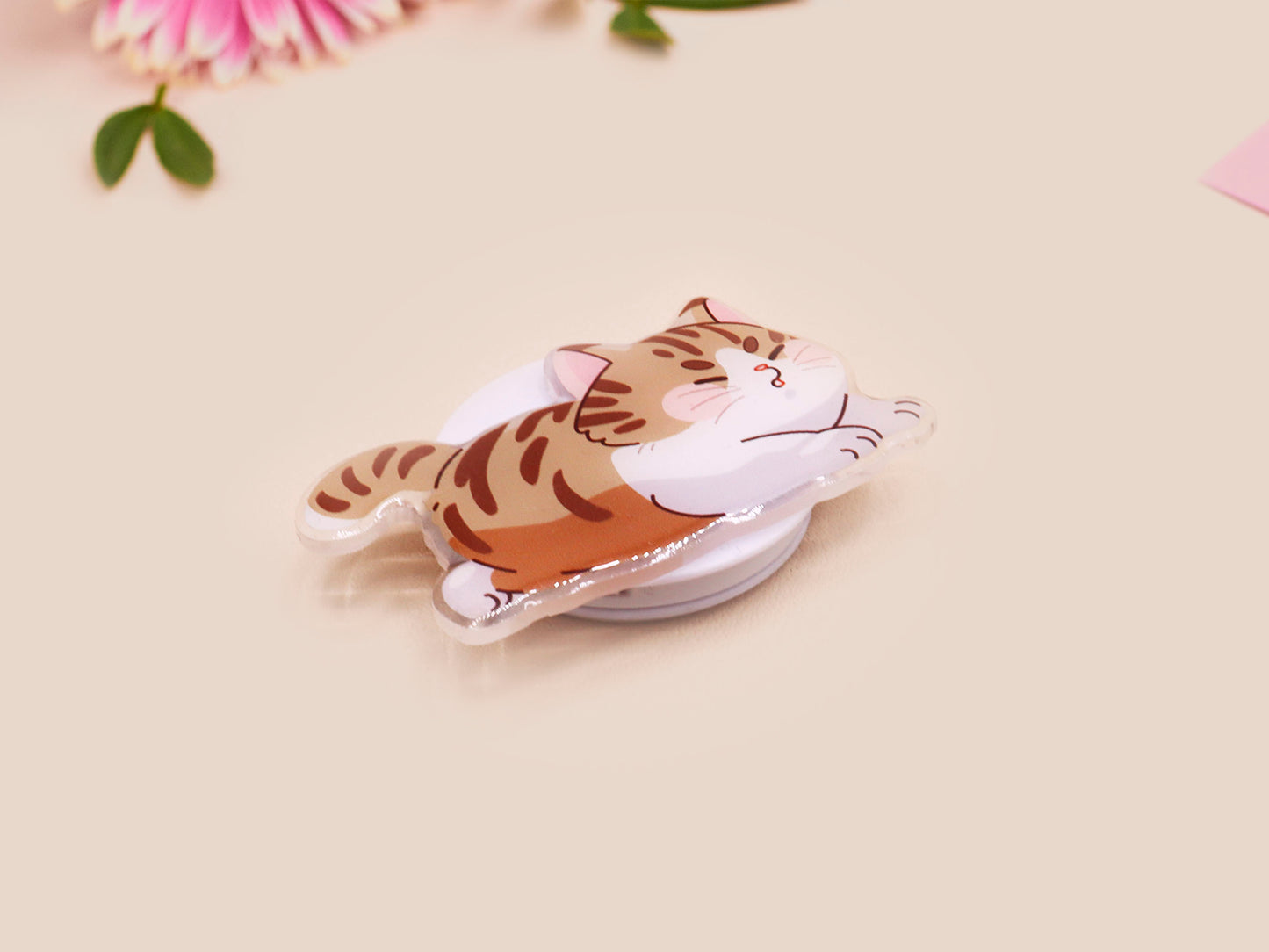 Cute acrylic popsocket phone grip of a stretching tabby cat kitten