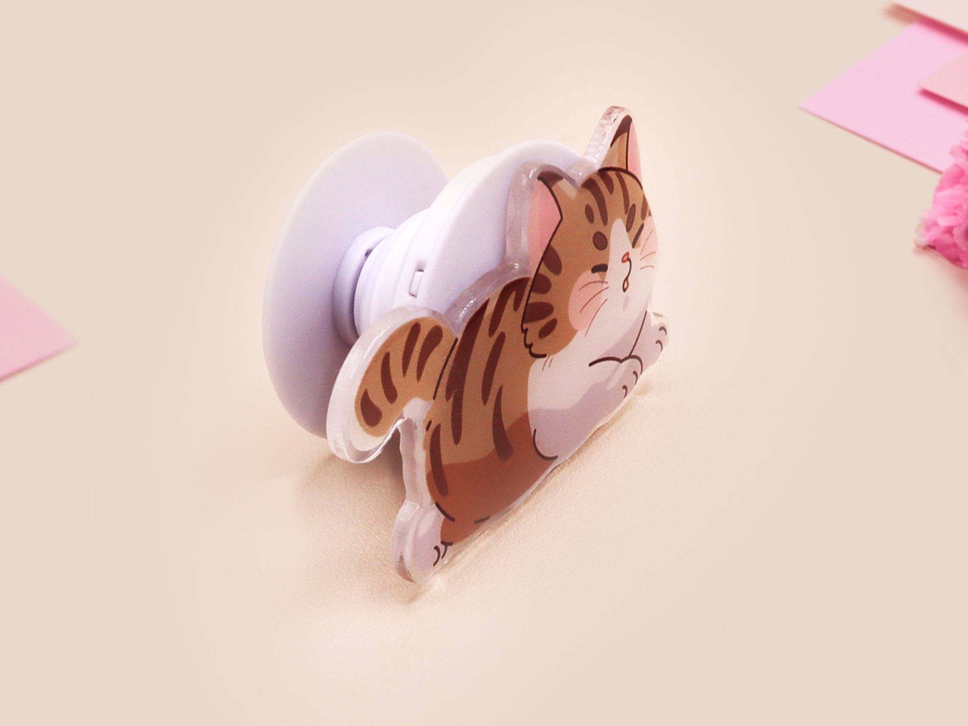 Cute acrylic popsocket phone grip of a stretching tabby cat kitten