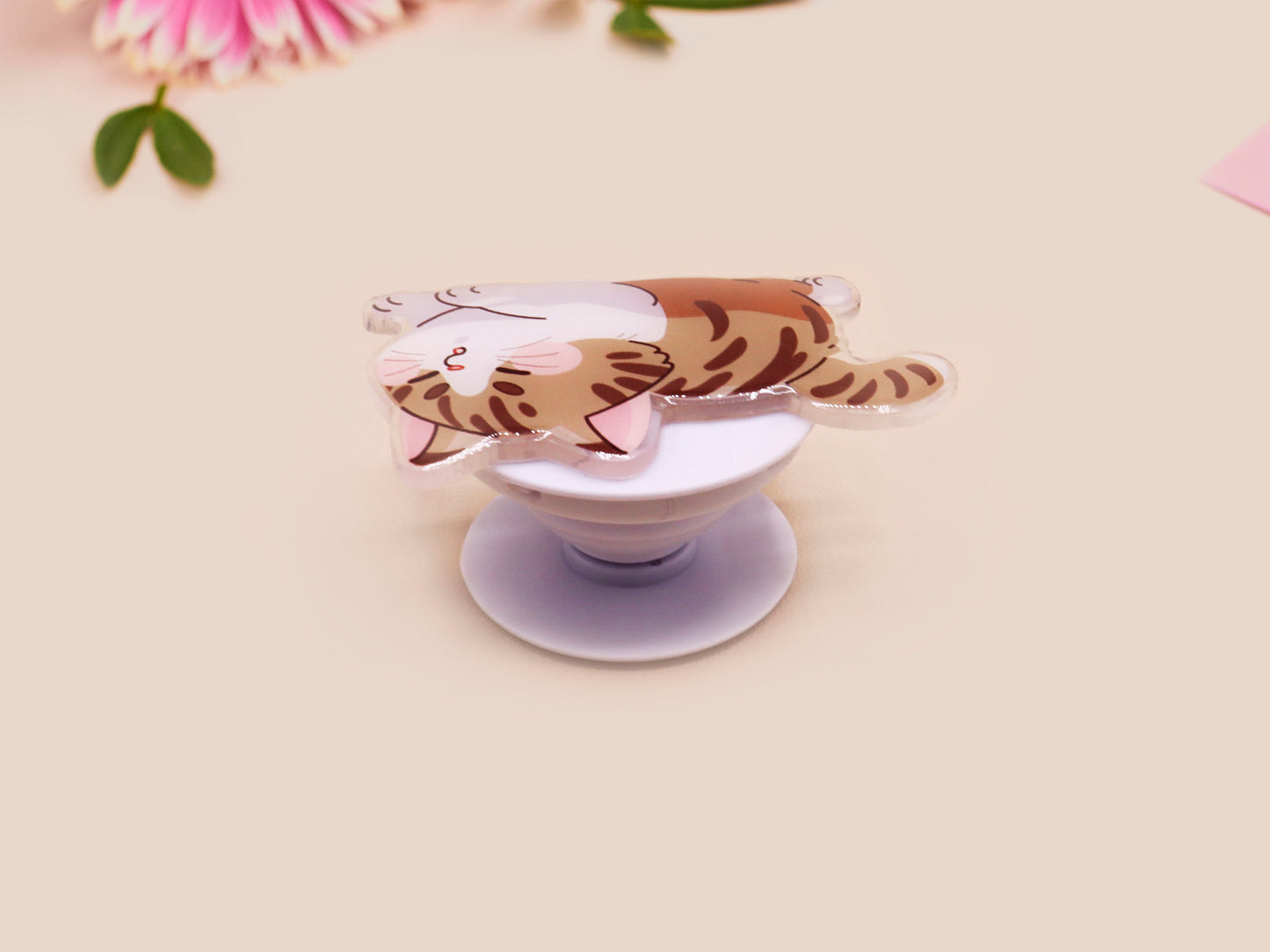 Cute acrylic popsocket phone grip of a stretching tabby cat kitten