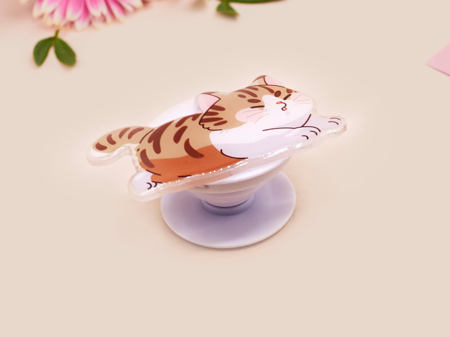 Cute acrylic popsocket phone grip of a stretching tabby cat kitten