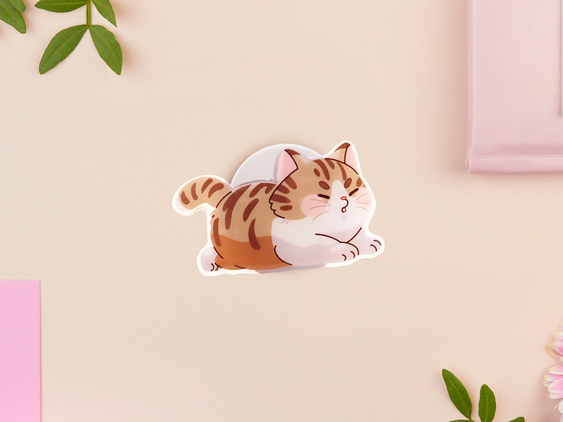 Cute acrylic popsocket phone grip of a stretching tabby cat kitten