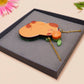 Adorable cute capybara with an orange on its head necklace made of wood and glitter pearlescent acrylic with a gold chain, displayed in a velvet gift box with a unique cute capybara sleeve design.