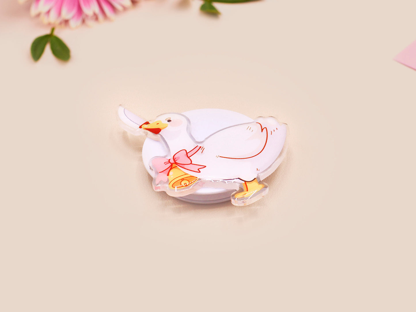 Cute popsocket phone grip with an adorable goose holding a knife wearing a pink bow and bell