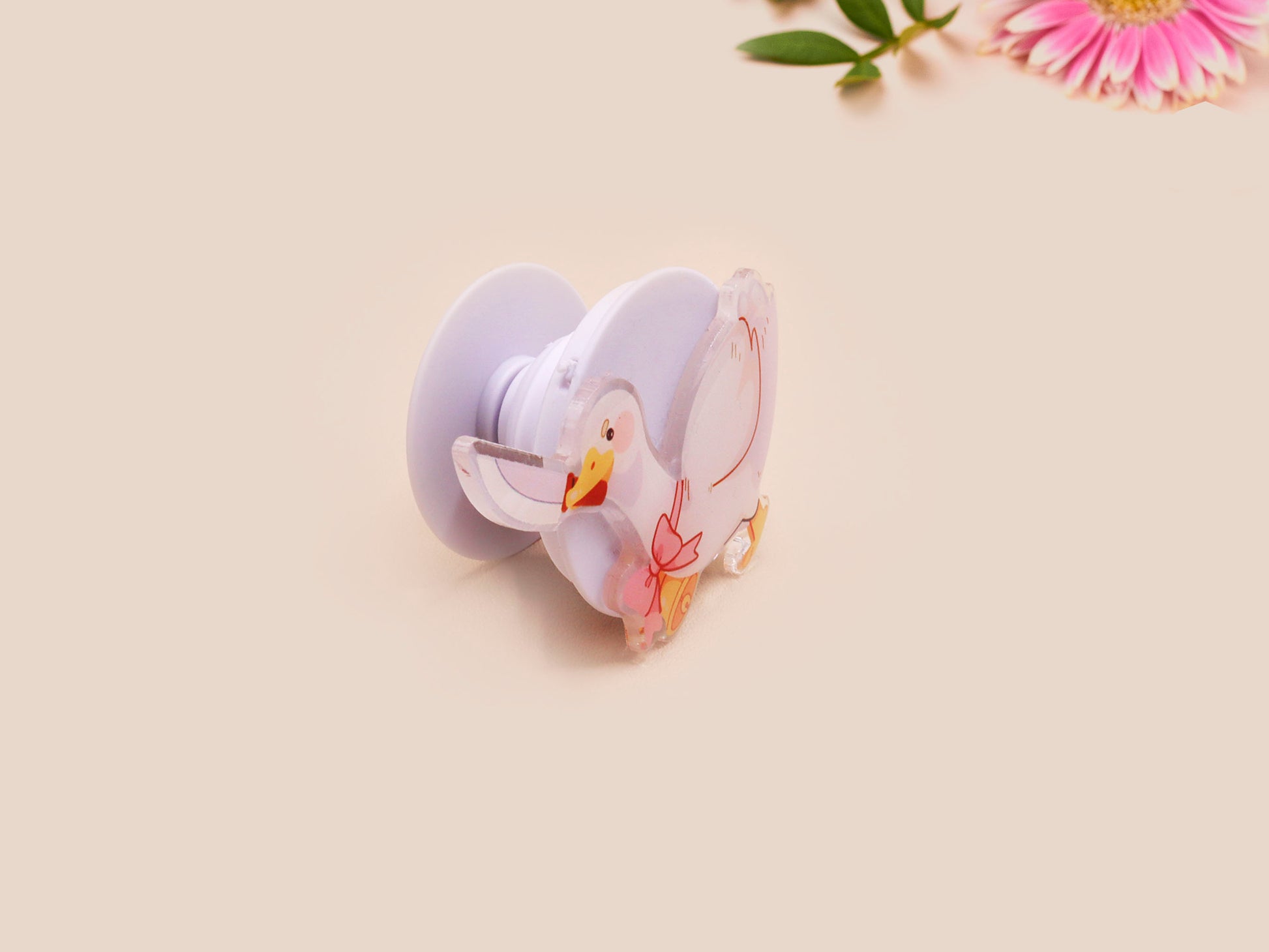 Cute popsocket phone grip with an adorable goose holding a knife wearing a pink bow and bell