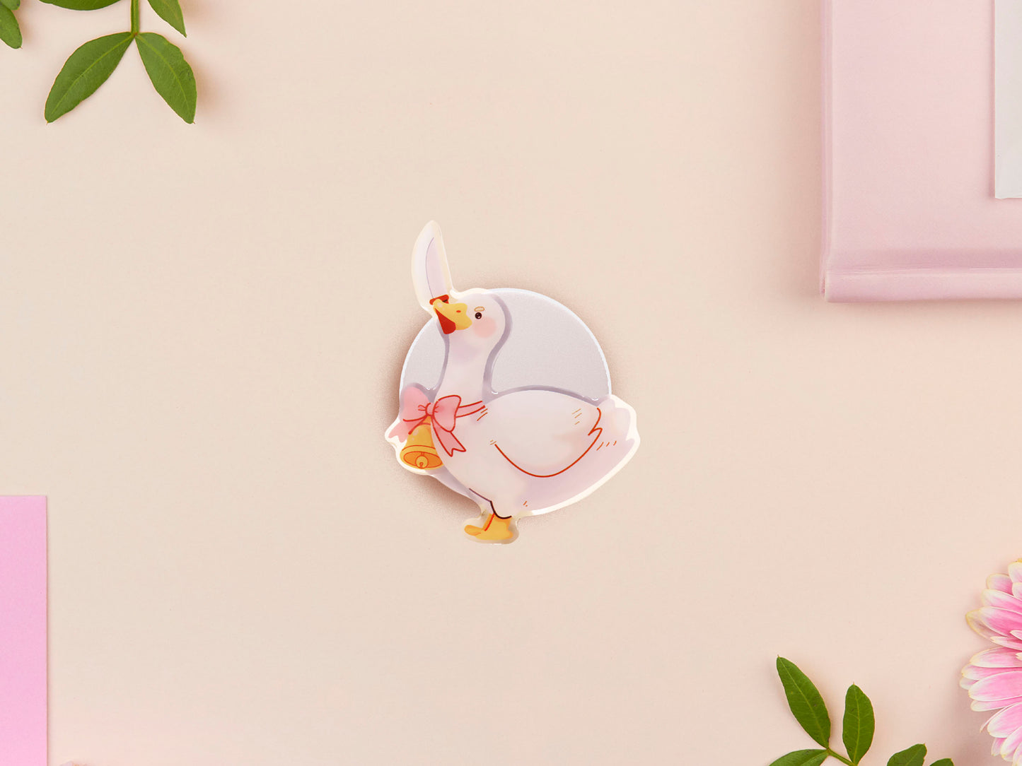 Cute popsocket phone grip with an adorable goose holding a knife wearing a pink bow and bell