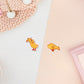 Two stickers of digitally illustrated cartoon of small yellow ducklings