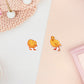 Two stickers of digitally illustrated cartoon of small yellow ducklings