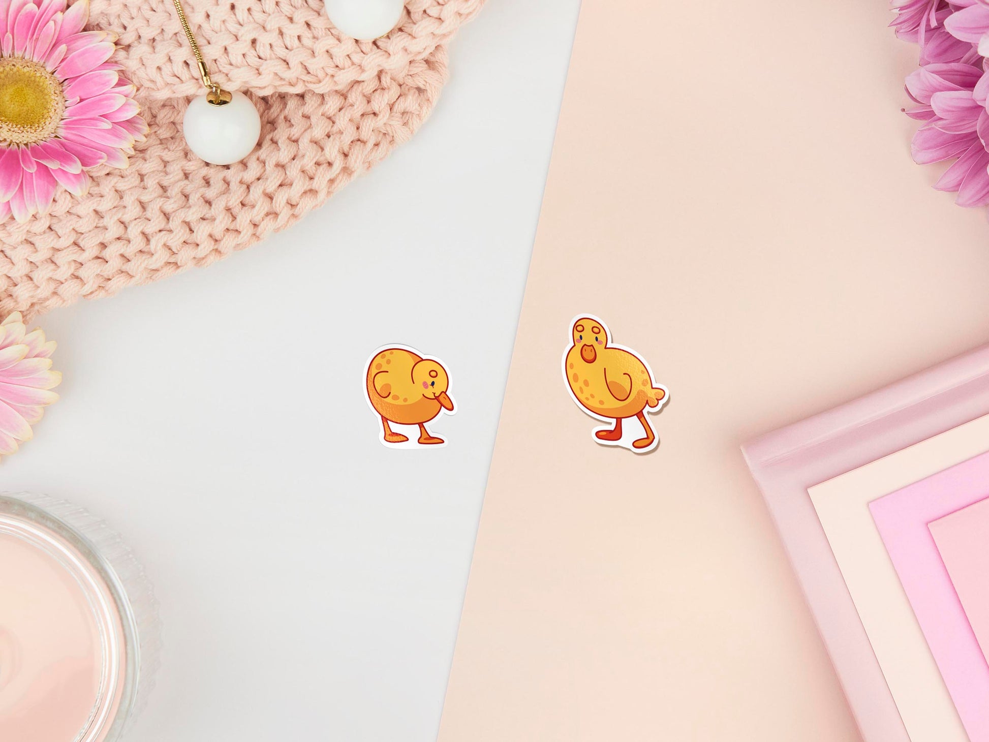 Two stickers of digitally illustrated cartoon of small yellow ducklings