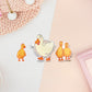 Three stickers of digitally illustrated cartoon ducks, one is a white adult duck the other are three small yellow ducklings