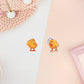 Two stickers of digitally illustrated cartoon of small yellow ducklings