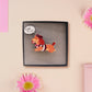 An adorable cute dachshund sausage dog brooch pin badge in a french outfit, a beret and a striped top, connected to a speech bubble that is engraved with the words oui oui! displayed in a velvet gift box with a unique cute dachshund sleeve design.