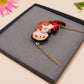 An adorable cute otter holding a clam seashell with a pearl inside necklace made of wood and glitter pearlescent acrylic with a gold chain is displayed in a velvet gift box with a unique cute otter sleeve design.