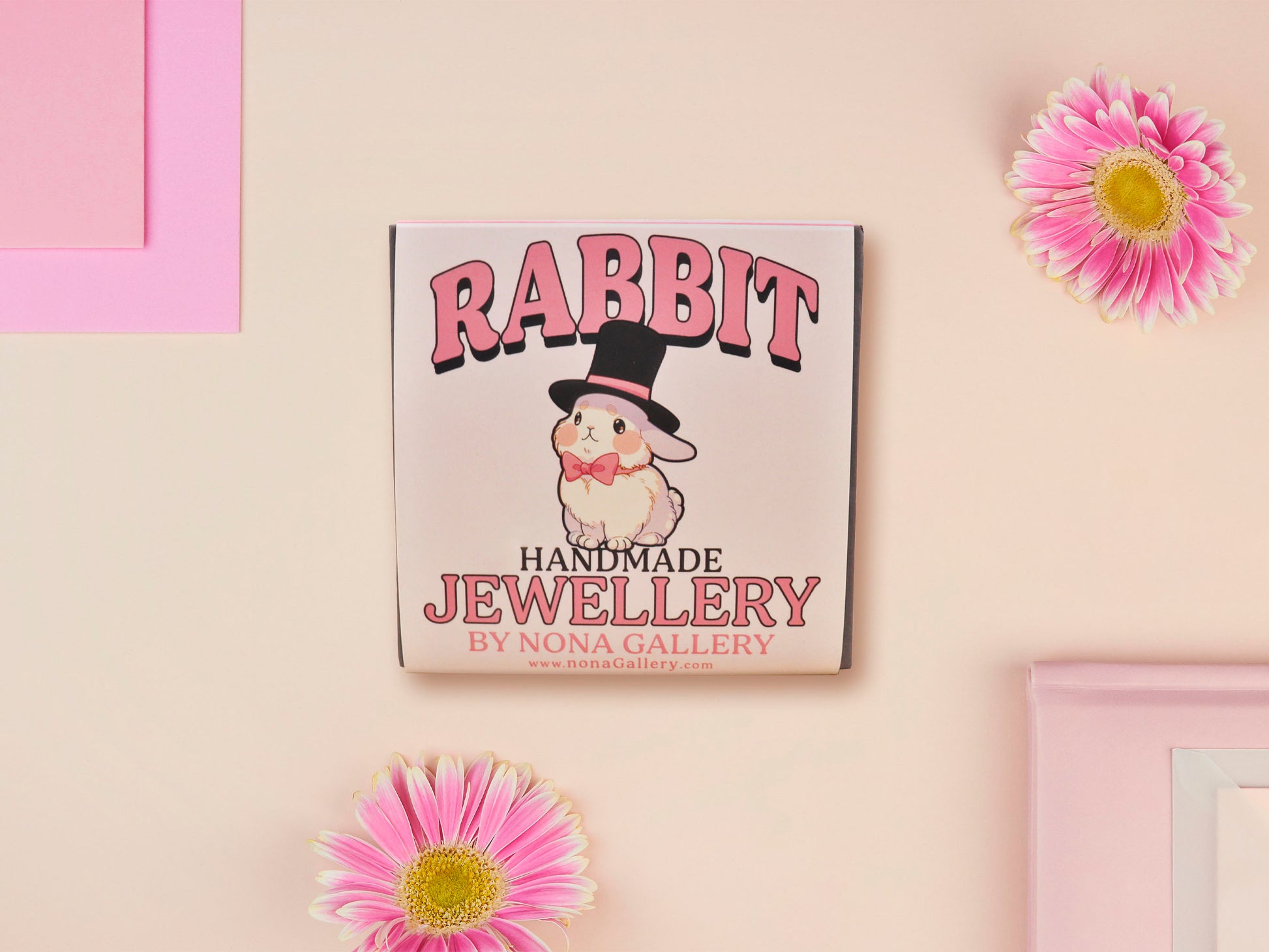 Adorable cute white bunny rabbit wearing a top hat and now tie necklace made of wood and mirror acrylic with a gold chain, displayed in a velvet gift box with a unique cute rabbit sleeve design.