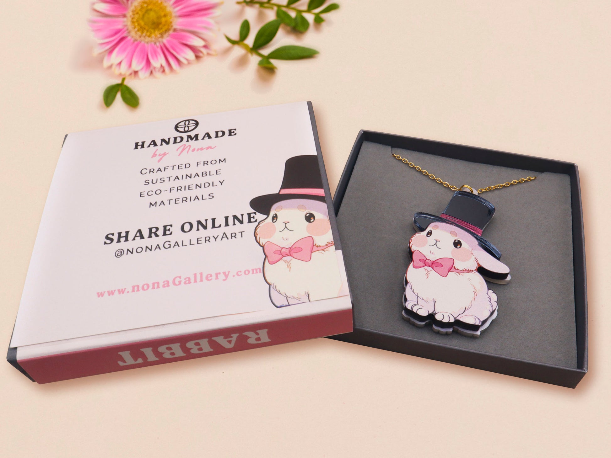 Adorable cute white bunny rabbit wearing a top hat and now tie necklace made of wood and mirror acrylic with a gold chain, displayed in a velvet gift box with a unique cute rabbit sleeve design.