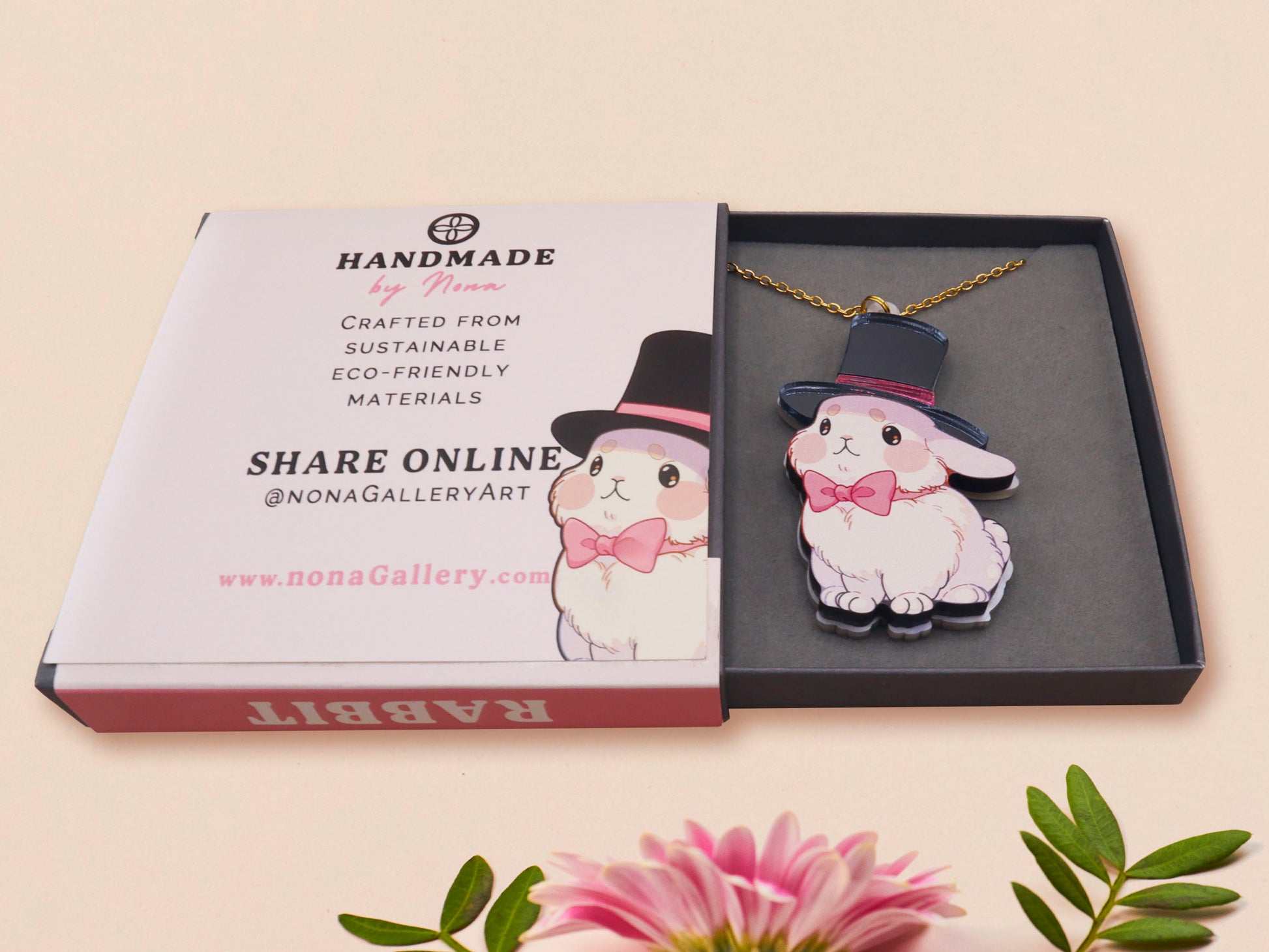 Adorable cute white bunny rabbit wearing a top hat and now tie necklace made of wood and mirror acrylic with a gold chain, displayed in a velvet gift box with a unique cute rabbit sleeve design.