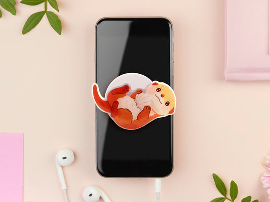 Cute acrylic popsocket phone grip of a sea otter holding a clam shell