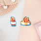 Cute large waterproof gloss vinyl sticker sheet of multiple chibi capybara guinea pigs enjoying a spa day