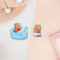 Cute large waterproof gloss vinyl sticker sheet of multiple chibi capybara guinea pigs enjoying a spa day