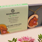 An adorable shy pangolin aardvark holding a heart necklace made of wood and glitter mirror acrylic with a gold chain is displayed in a velvet gift box with a unique cute Pangolin sleeve design.