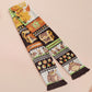 Cute knitted scarf with cute chibi Tabletop RPG Cryptid Monsters from DND such as Owlbears, Almiraj Rabbits, a Displacer Beast Kitten, Beholder, sleeping baby dragon and Mimic chests