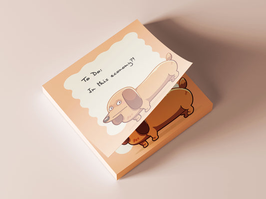 Orange sticky note notepad with a cute chibi dachshund sausage dog design
