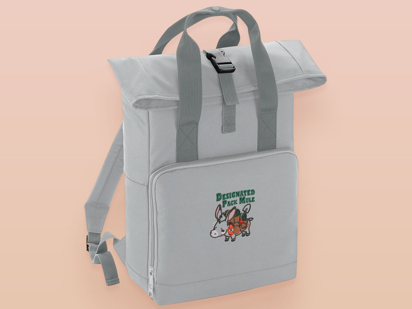 Light Grey roll top twin handle backpack with an embroidered design of a stressed out pack mule donkey and the quote designated pack mule