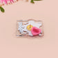 Cute transparent acrylic pin badge with a pink heart-shaped pin back clasp. The design of the badge is a chibi hench and buff cat with the quote Did you justPSPSPSPSPST my gurl?!