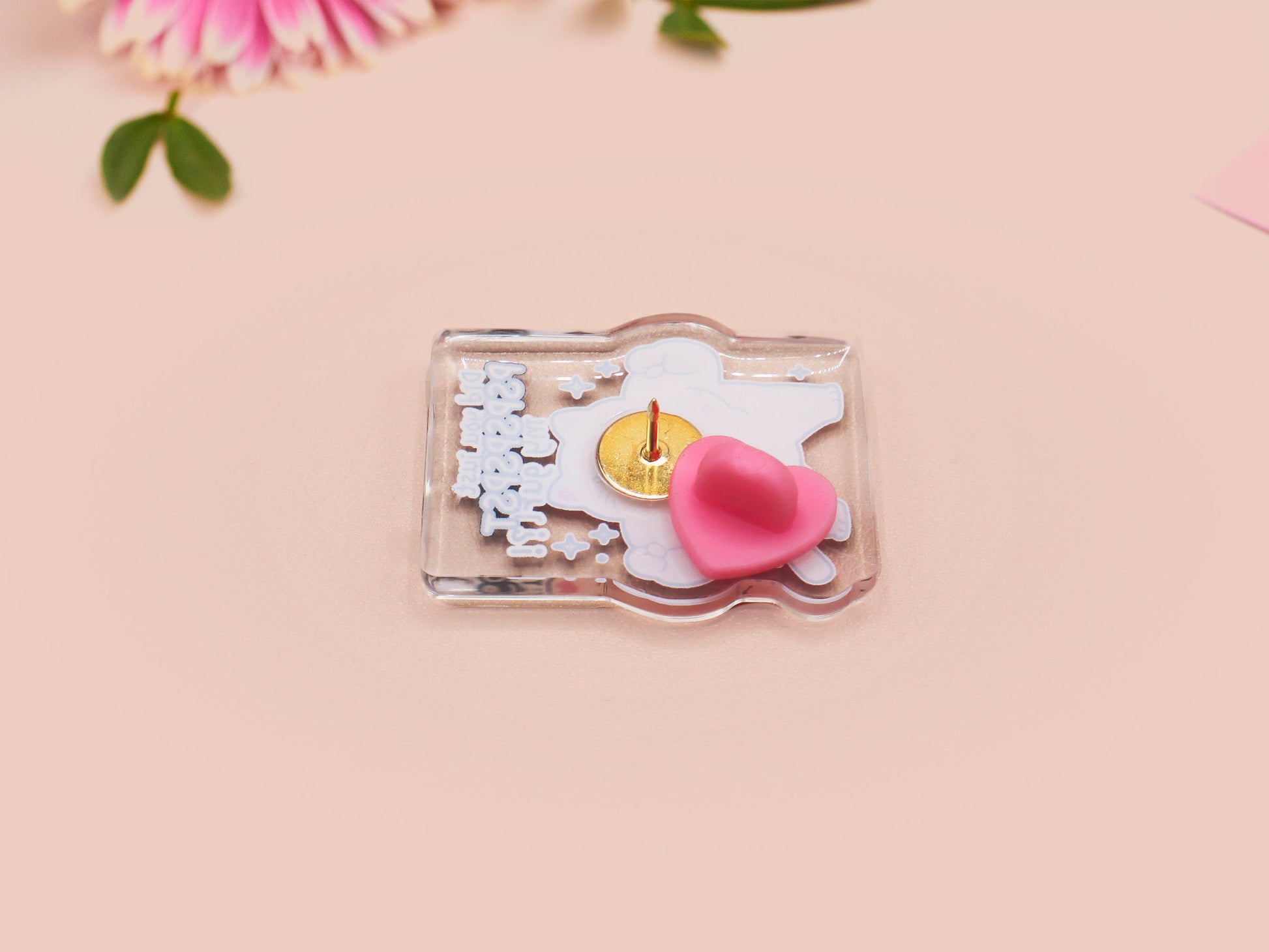 Cute transparent acrylic pin badge with a pink heart-shaped pin back clasp. The design of the badge is a chibi hench and buff cat with the quote Did you justPSPSPSPSPST my gurl?!