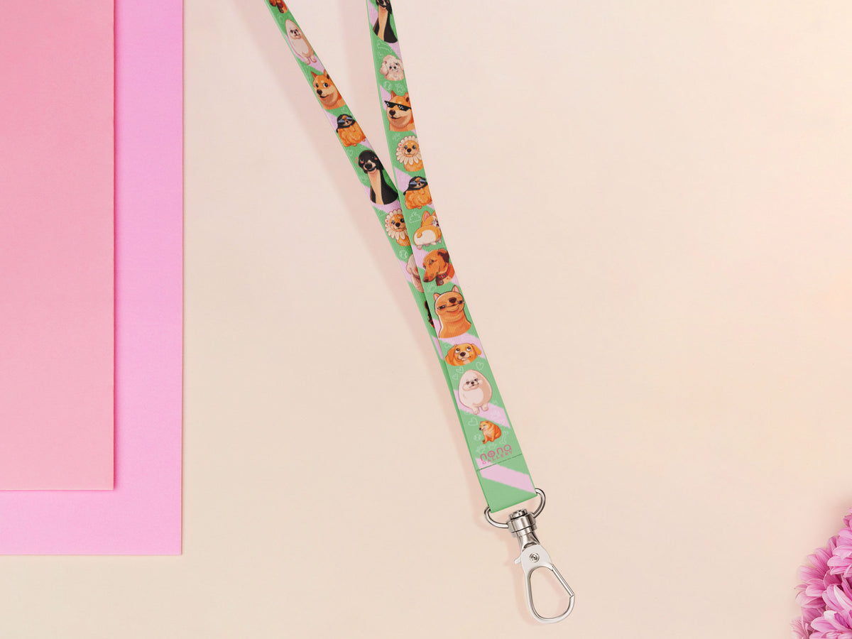 Cute full legth green lanyard with a double sided cute chibi dog meme pattern and silver swivel hook clasp.