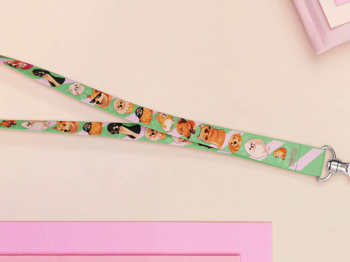 Cute full legth green lanyard with a double sided cute chibi dog meme pattern and silver swivel hook clasp.