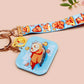 Acrylic epoxy blue capybara spa keychain with a large acrylic charm of a capybara floating in water relaxing with a face mask with the quote don't worry be cappy, a smaller charm of a cute rubber duck and a matching capybara spa day lanyard.