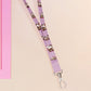 Cute full legth purple lanyard with a double sided funny screaming possums  pattern and silver swivel hook clasp.