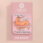 A cute transparent acrylic pin badge with a pink heart-shaped rubber clasp pin back. The design of the pin badge is a cartoon orange worm on a sting sitting on a sofa chaise lounge with the titanic quote Draw Me Like One of Your French Worms