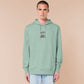 An embroidered green hoodie design of a cute frog happily looking at his binder of tcg trading cards surrounded by the quote Just Me And My Shiny Cardboard Against The World