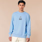 Sweater with an embroidered blue design of a cute Neal the seal smuggly wearing an orange and white trafic cone with the quote meance to society
