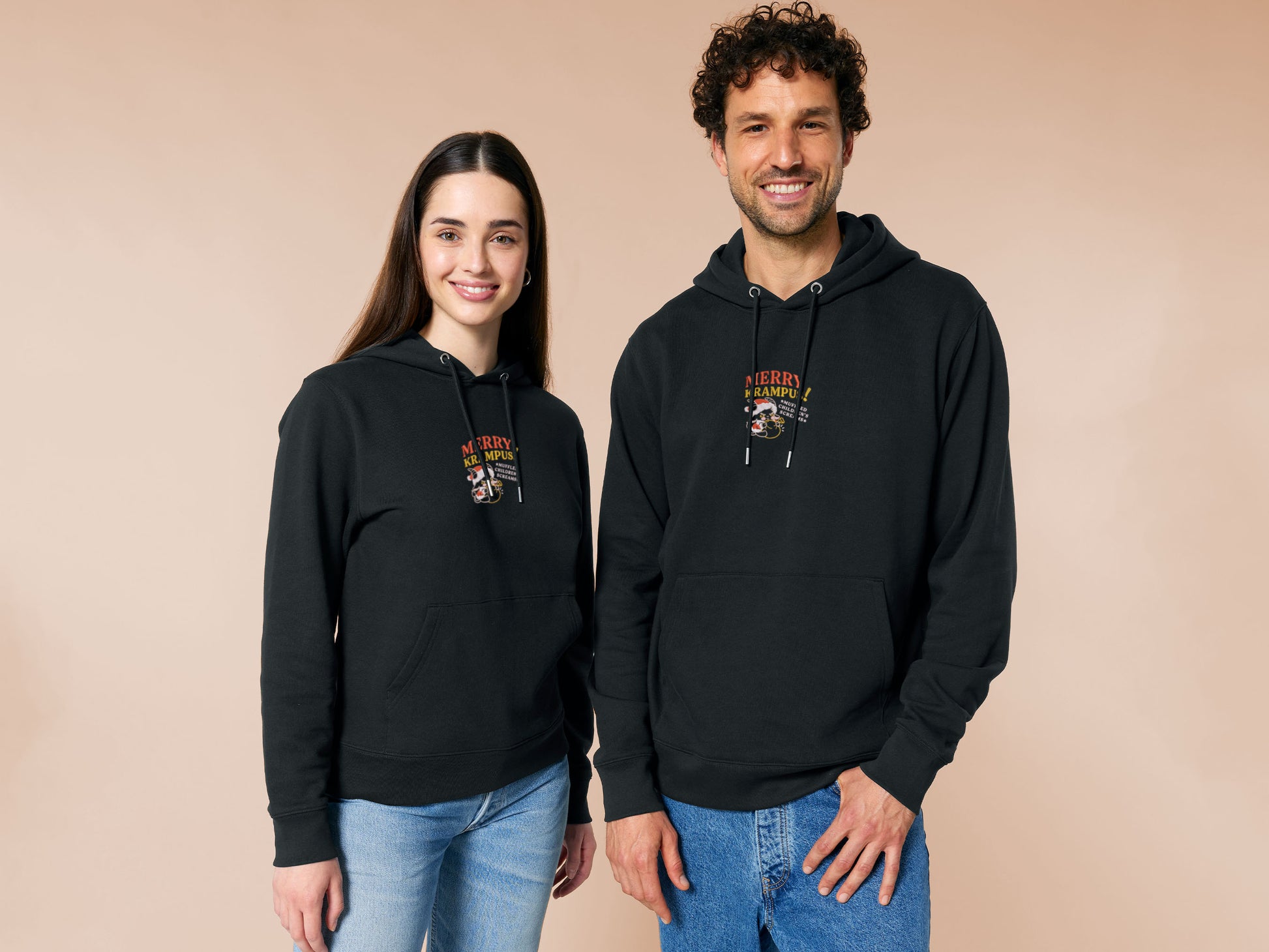 A black crew neck long sleeve hoodie, with an embroidered chibi krampus christmas demon holdign a sack and the quote Mery Krampus! Muffled Children's screams