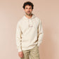 A cream crew neck long sleeve hoodie, with an embroidered brown thread design of a cute daschund dog looking concerend surrounded by the quote In This Economy?