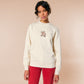 A cream crew neck long sleeve sweater, with an embroidered design of a cute shiba inu dog looking stressed surrounded by the quote Let Me Just Overthink This