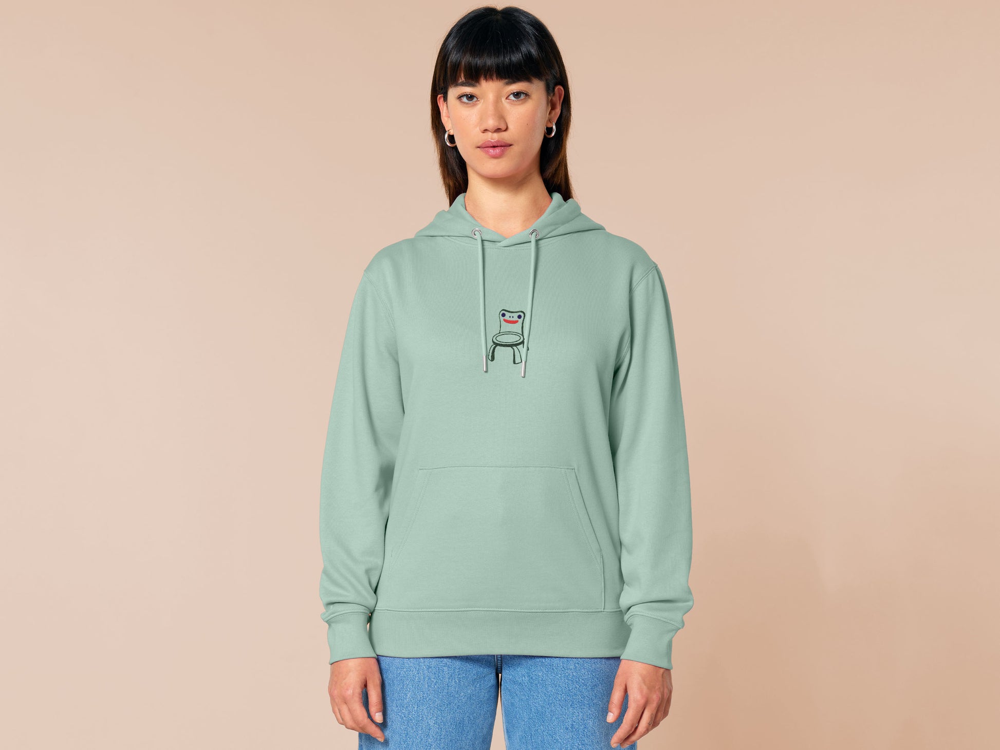 Embroidered green hoodie with a design inspired by the iconic meme froggy chair from the Nintendo game animal crossing